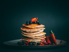 pancakes with strawberries and blueberries on top