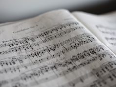 “What Game Has the Best Music?” tilt selective photograph of music notes