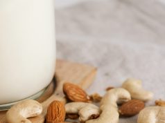 brown almond nuts on white textile